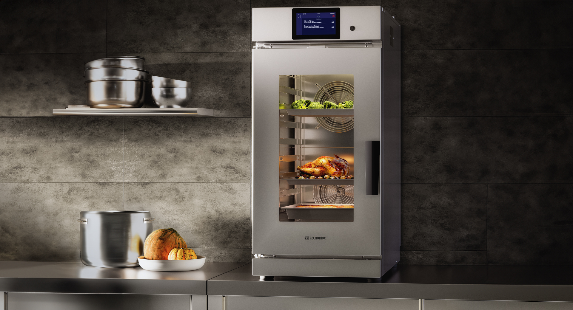 Foto di una cucina con un forno Tecnocompact con al suo interno verdure e un pollo in cottura